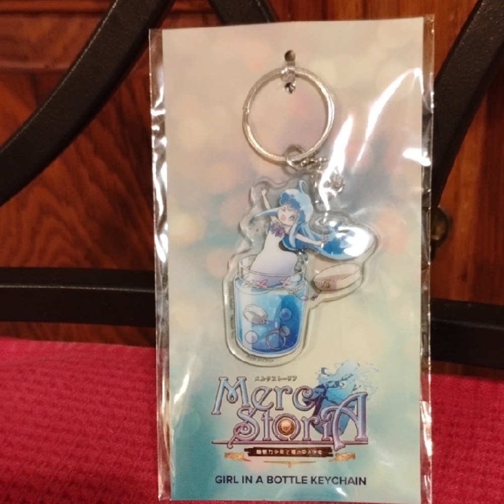 🌟 Merc Storia “Girl in a Bottle” Keychain – NWT/Sealed 🌟